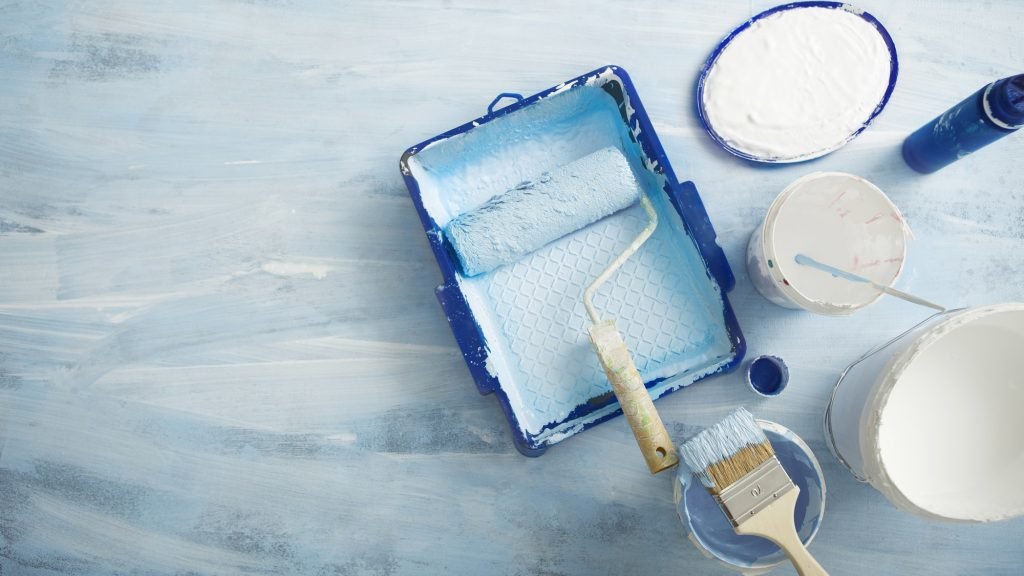 Painting tools for renovation on blue background